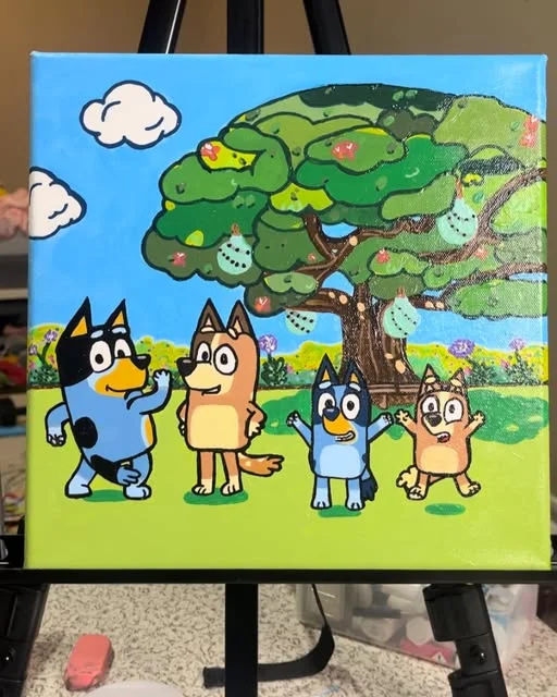 Bluey family painted under a tree