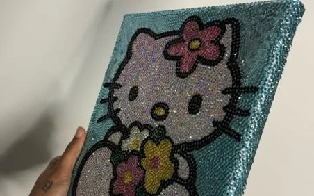 Hello Kitty rendered fully in rhinestones on canvas